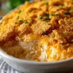 Baked Ritz Cracker Chicken Casserole in a white ceramic dish with golden crispy topping.