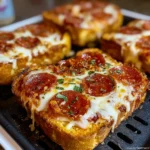 Golden Texas toast pizza slices topped with melted mozzarella and pepperoni, served fresh from the air fryer.