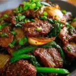 Beef stir-fried with Chinese onions in a savory brown sauce served over white rice.