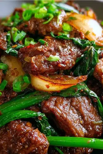 Beef stir-fried with Chinese onions in a savory brown sauce served over white rice.