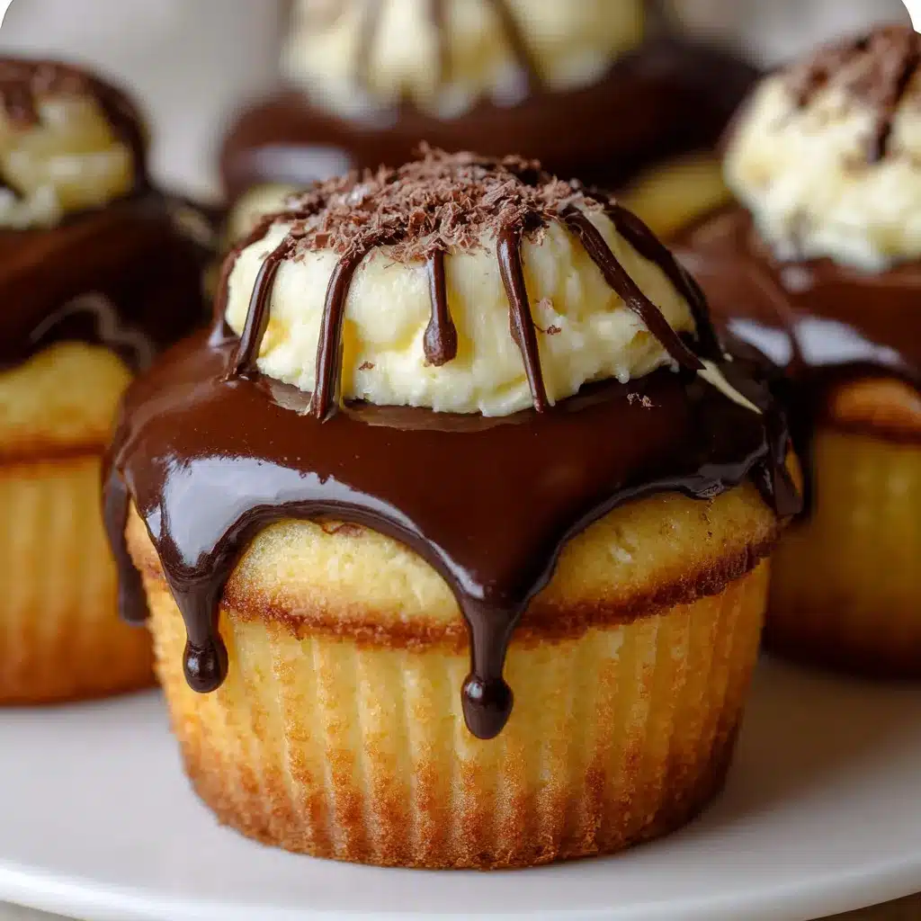 Close-up of Boston Cream Pie Cupcakes with rich chocolate ganache and creamy custard filling