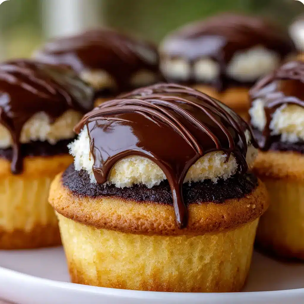 Close-up of Boston Cream Pie Cupcakes with rich chocolate ganache and creamy custard filling