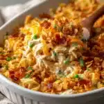 Million Dollar Chicken Casserole topped with Ritz crackers, baked until golden and bubbling in a casserole dish.