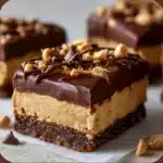 Chocolate Peanut Butter No-Bake Bars with creamy peanut buttery base and glossy chocolate topping.