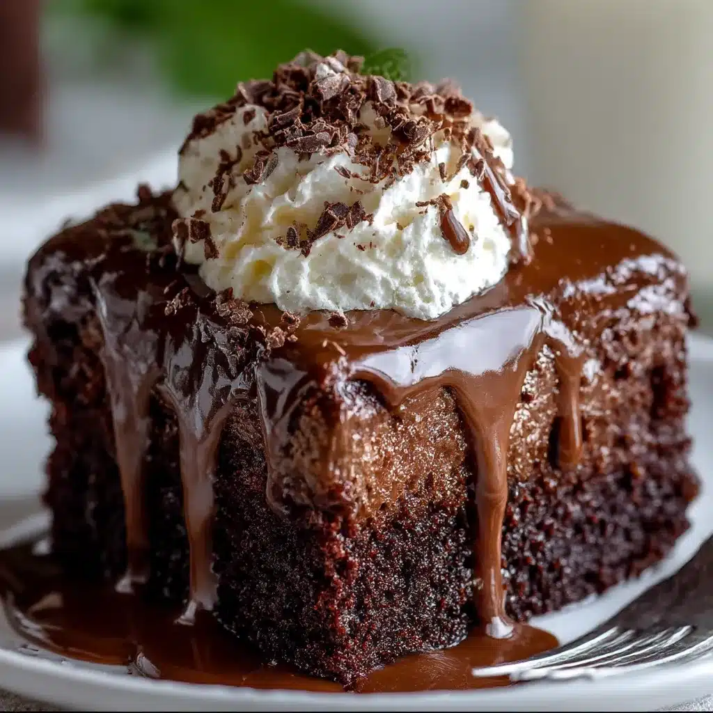 Baileys Chocolate Poke Cake topped with chocolate ganache and whipped cream