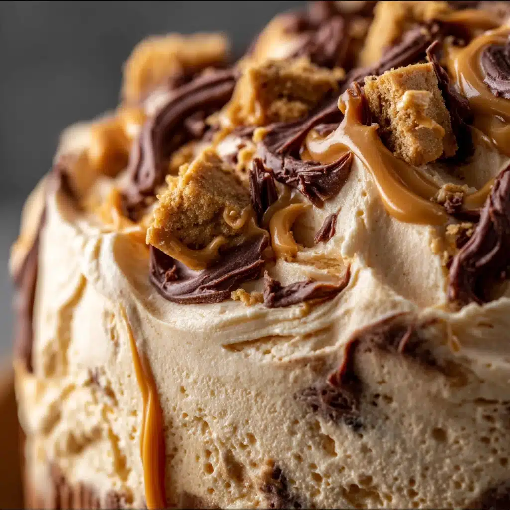 Reese’s Peanut Butter Fluff dessert in a bowl with chocolate chips and chopped Reese’s pieces