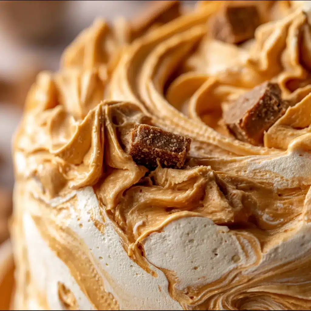 Reese’s Peanut Butter Fluff dessert in a bowl with chocolate chips and chopped Reese’s pieces