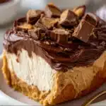 Reese’s Peanut Butter Fluff dessert in a bowl with chocolate chips and chopped Reese’s pieces