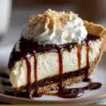 Root Beer Float Pie with whipped cream and maraschino cherries in a graham cracker crust