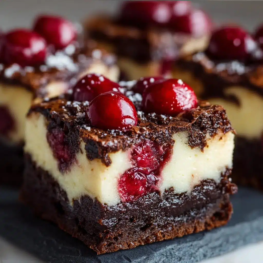 Cherry cheesecake brownies with chocolate base, creamy cheesecake layer, and bright cherry swirl on top.