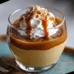 Bowl of creamy homemade butterscotch pudding topped with whipped cream